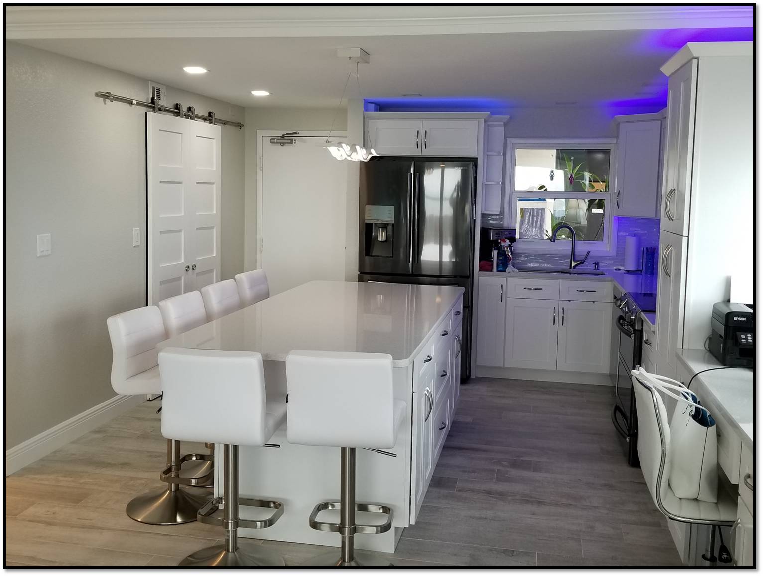Resurfaced white kitchen cabinets with island in Clearwater FL
